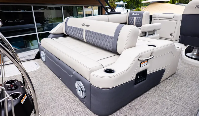 Slide: The Image of The image shows a luxurious seating area on a Barletta LUSSO 25U boat. - 4