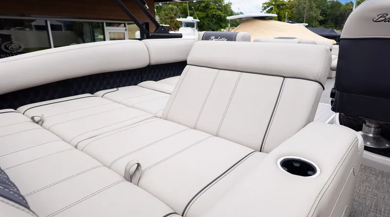 Slide: The Image of Luxurious cream-colored upholstery on a 2025 Barletta LUSSO 25U boat. - 7