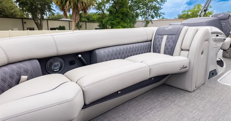 Slide: The Image of The image shows the luxurious interior of a Barletta LUSSO 25U boat with elegant seating. - 17