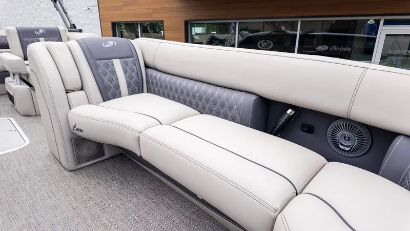 Slide: The Image of The image shows the luxurious interior of a 2025 Barletta LUSSO 25U with elegant seating. - 12