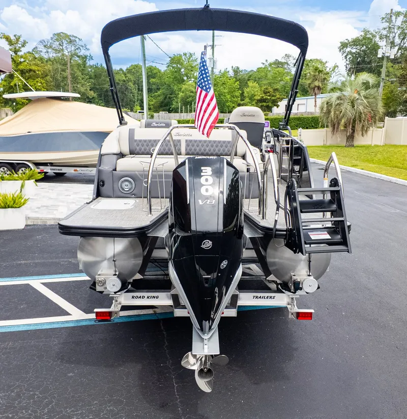 Slide: The Image of The image shows a 2025 Barletta LUSSO 25U pontoon boat with a 300 HP outboard motor. - 3
