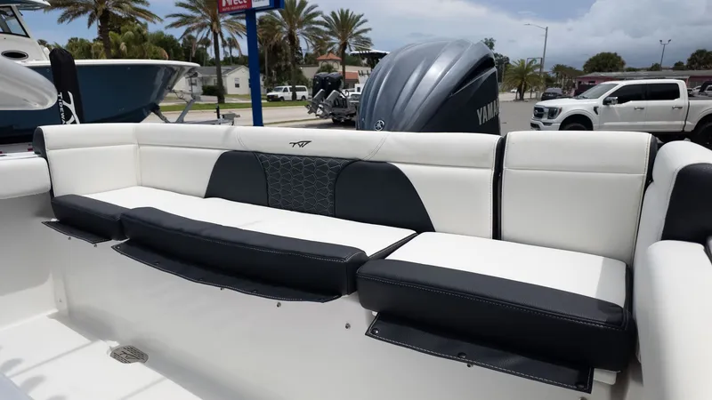 Slide: The Image of The 2027 Tidewater 232 LXF features a stylish bench seat with black and white upholstery. - 6