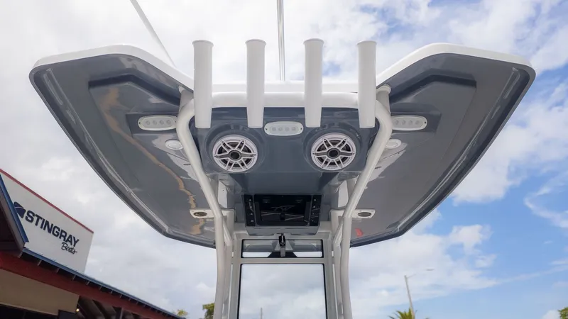 Slide: The Image of View of a boat's T-top with speakers and fishing rod holders. - 4