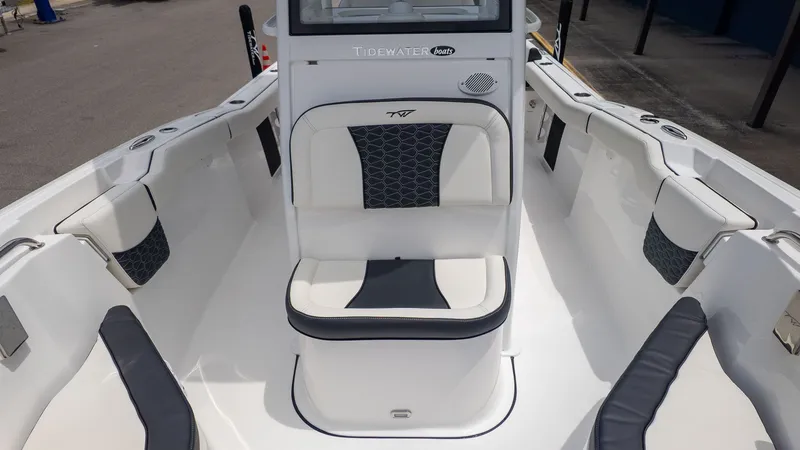 Slide: The Image of The image shows the cockpit of a 2027 Tidewater 232 LXF boat with sleek seating. - 14