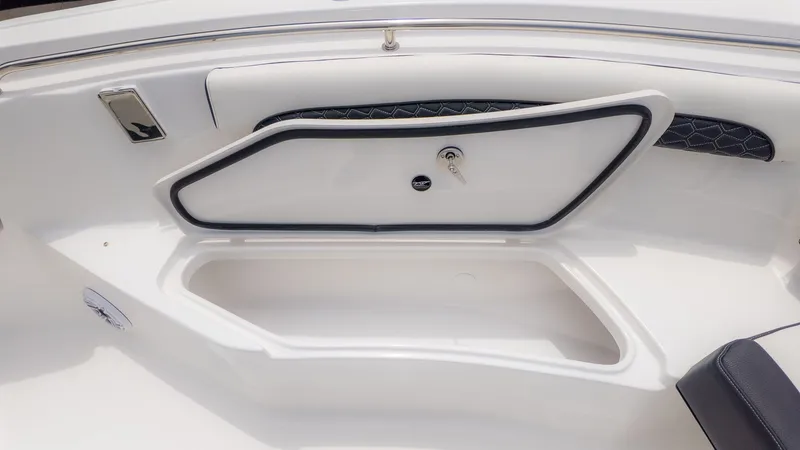 Slide: The Image of The image shows a white boat with an open storage compartment and a closed compartment. - 13