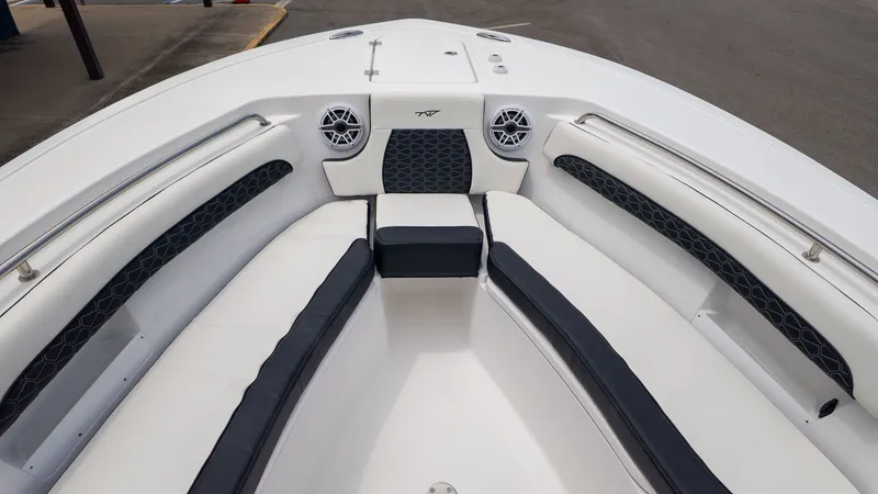 Slide: The Image of The image shows the bow of a Tidewater 232 LXF boat with cushioned seating and speakers. - 10