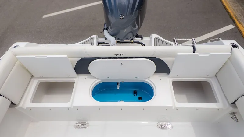 Slide: The Image of The image shows the stern of a Tidewater 232 LXF boat with an outboard motor. - 6