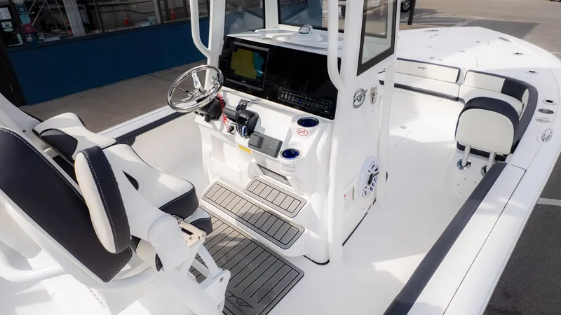 Slide: The Image of The image shows the cockpit of a 2026 Tidewater 2300 Carolina Bay boat. - 12