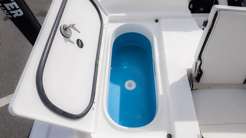 Slide: The Image of An open storage compartment with a blue interior on a boat. - 7