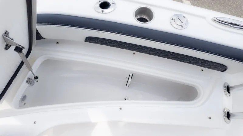 Slide: The Image of The image shows an open storage compartment on a boat with white and gray details. - 18