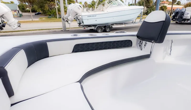 Slide: The Image of The image shows the cockpit of a Tidewater 2300 Carolina Bay boat with cushioned seating. - 16