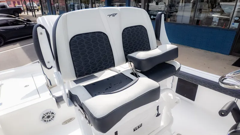 Slide: The Image of The Tidewater 2300 Carolina Bay seats are white with black accents and padded. - 12
