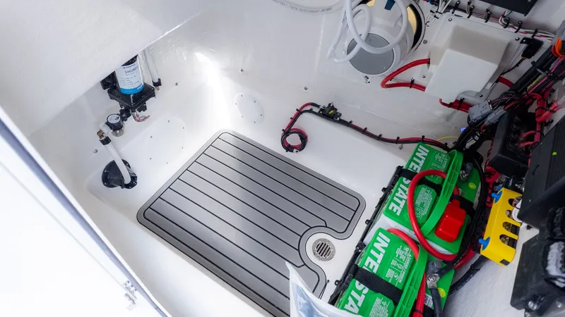 Slide: The Image of Interior of a boat with batteries and wiring. - 23