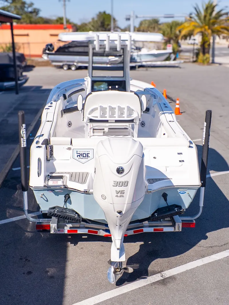 Slide: The Image of The image shows a 2026 Tidewater 232 LXF boat with a 300 HP outboard motor. - 3