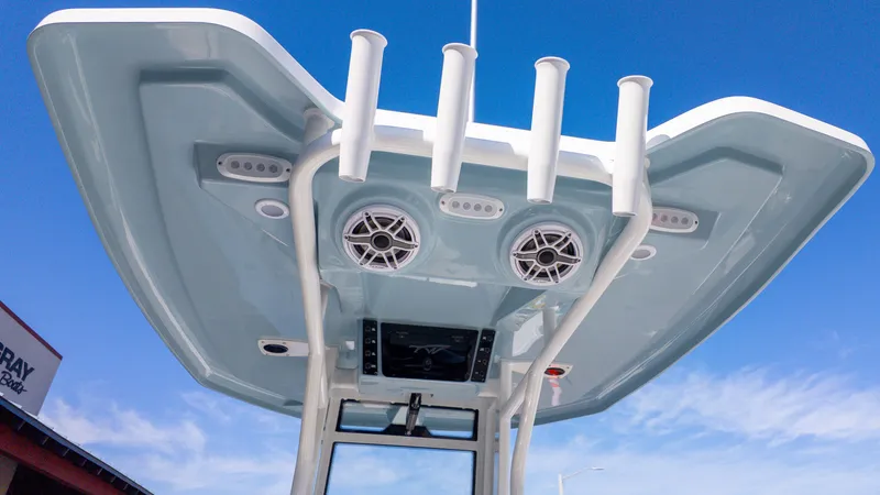 Slide: The Image of View of a Tidewater 232 LXF hardtop with speakers and fishing rod holders. - 7