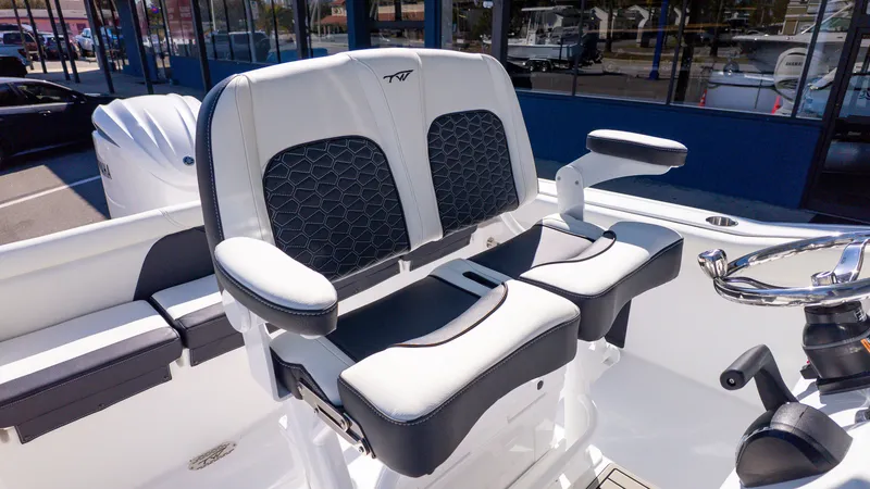 Slide: The Image of The 2026 Tidewater 232 LXF features luxurious padded seats with armrests and a modern design. - 10