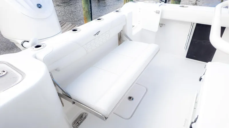 Slide: The Image of The image shows a white bench seat on a boat, surrounded by a clean, modern deck. - 8