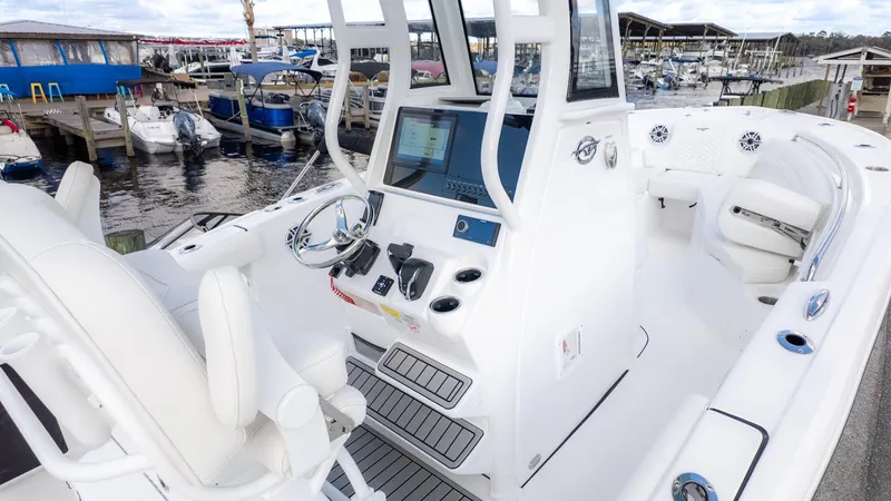 Slide: The Image of The image shows a modern boat with a sleek white helm and comfortable seating. - 12