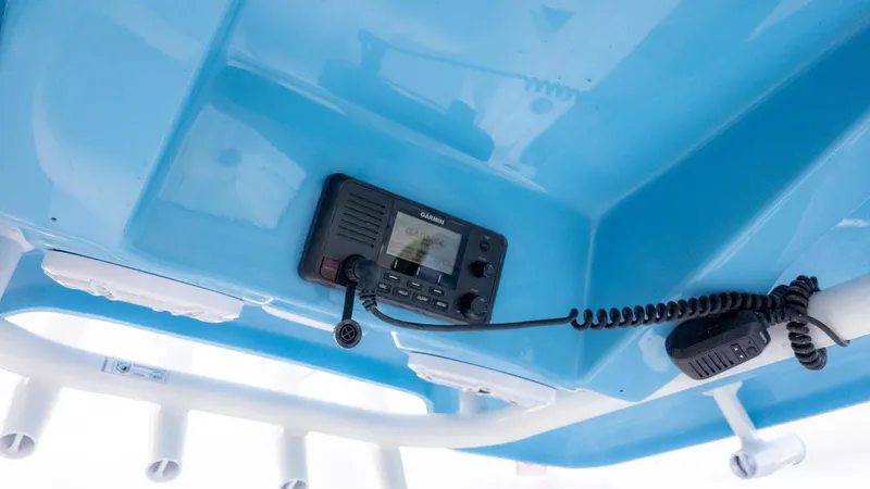 Slide: The Image of View of a blue boat canopy with a built-in radio and microphone. - 11