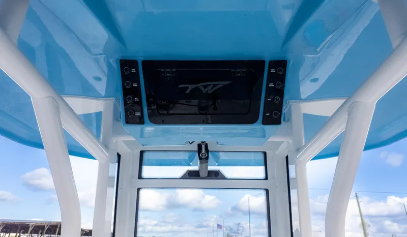 Slide: The Image of View of a boat's blue roof with control console and windows below. - 10