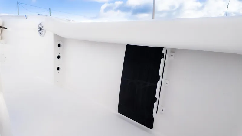 Slide: The Image of The image shows the interior of a boat with white walls and a black insert. - 3