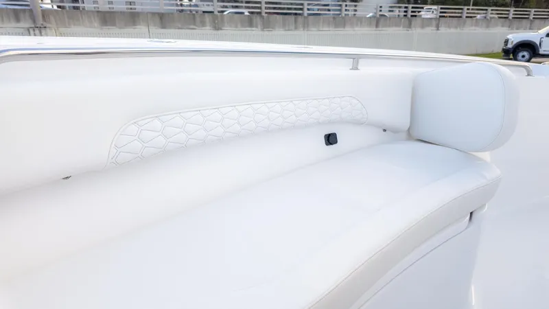 Slide: The Image of The 2026 Tidewater 232 CC Adventure features sleek white upholstery with a modern design. - 17