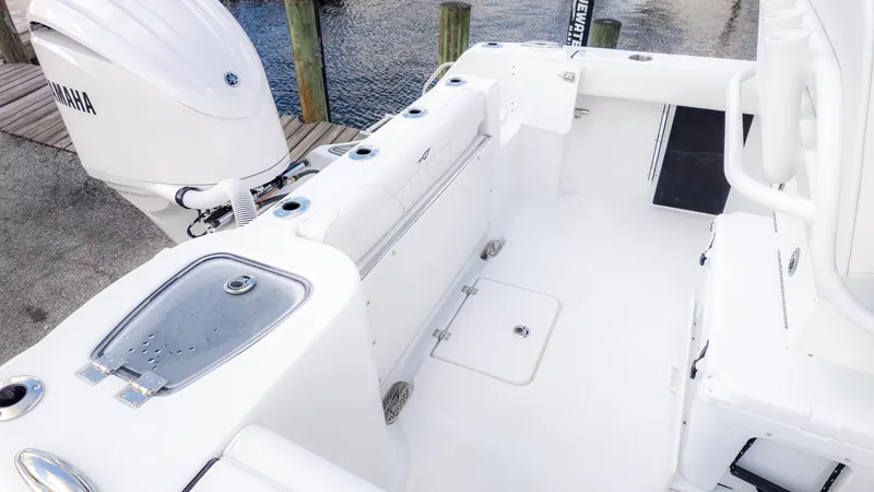 Slide: The Image of The image shows the cockpit of a Tidewater 232 CC Adventure boat with a Yamaha outboard motor. - 4