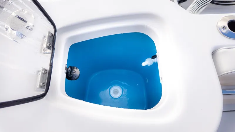 Slide: The Image of An open compartment with blue water, likely a livewell on a boat. - 5