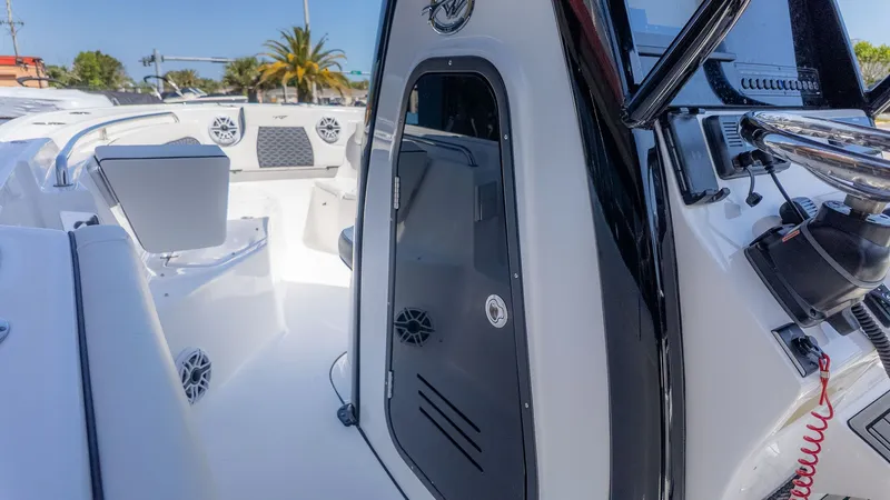 Slide: The Image of The image shows the cockpit of a Tidewater 232 LXF boat with modern controls. - 10