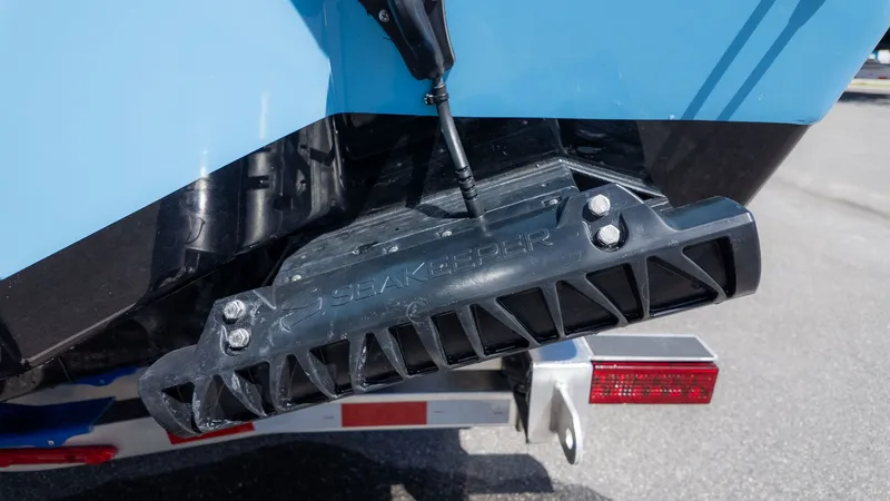 Slide: The Image of Close-up of a boat stabilizer on the stern of a blue boat. - 5