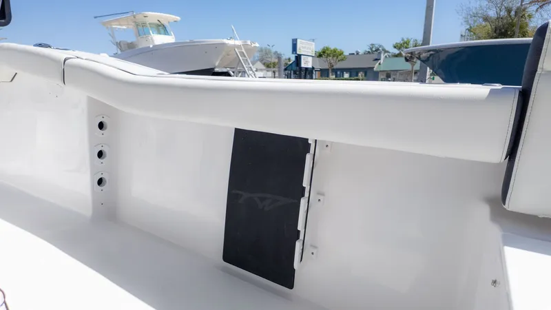 Slide: The Image of Close-up of a Tidewater 232 LXF boat interior with white upholstery. - 19