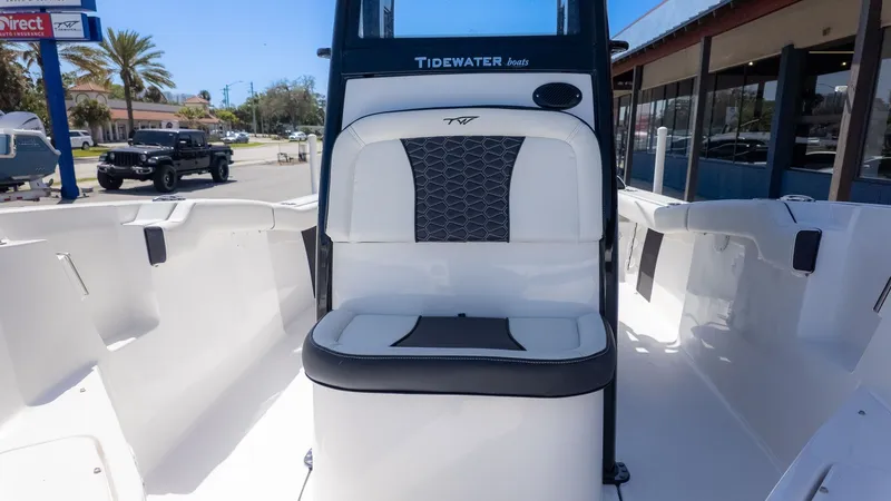 Slide: The Image of The image shows the cockpit of a Tidewater 232 LXF boat with a white and black seat. - 14