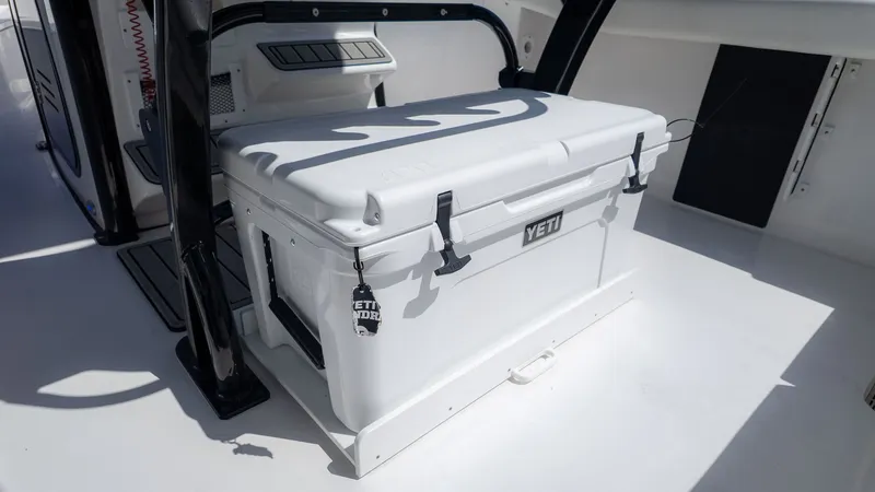 Slide: The Image of A white Yeti cooler on a boat, surrounded by clean, bright decking. - 7