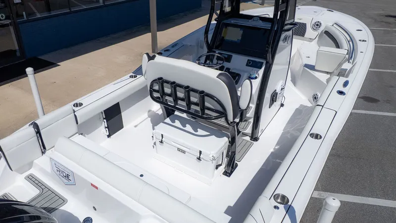 Slide: The Image of The image shows a modern boat with a central console and white seating. - 22