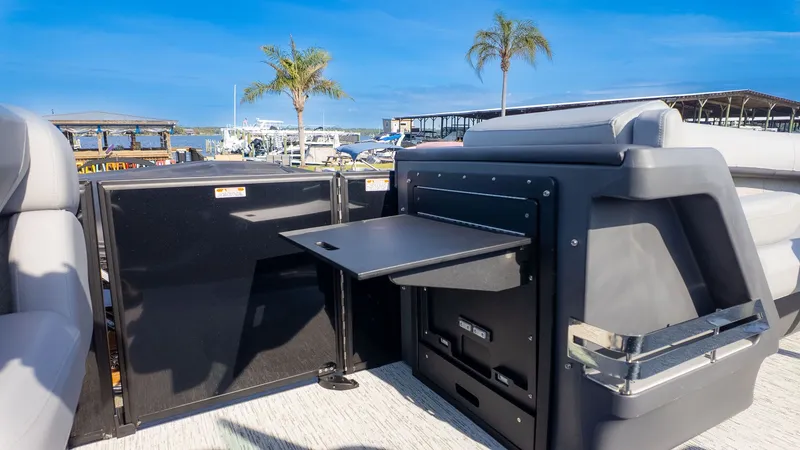 Slide: The Image of The image shows the stern of a 2026 Bennington 24 M Stern Lounge with a fold-out table. - 10