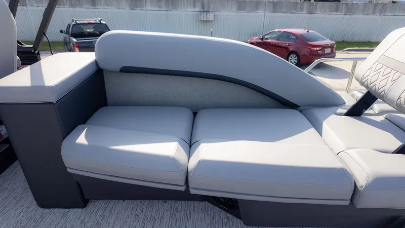 Slide: The Image of The image shows a gray seating area on a boat with modern upholstery. - 5