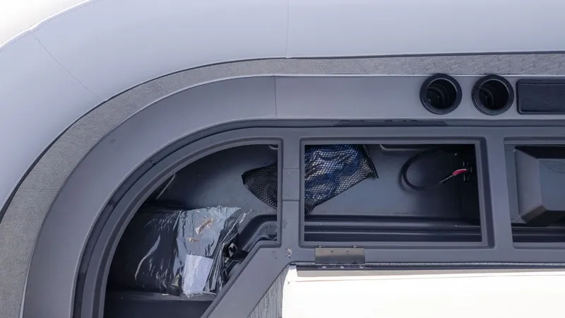 Slide: The Image of Close-up of a storage compartment on a Bennington 24 M Stern Lounge boat. - 17