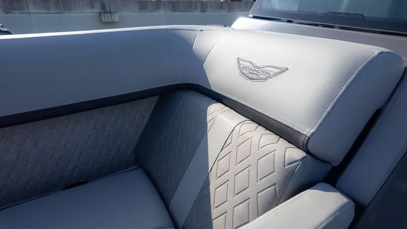 Slide: The Image of Close-up of a luxurious gray seat with Bennington logo on a boat. - 16