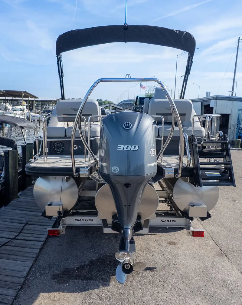Slide: The Image of The image shows a 2026 Bennington 24 M Stern Lounge boat with a 300 HP outboard motor. - 4