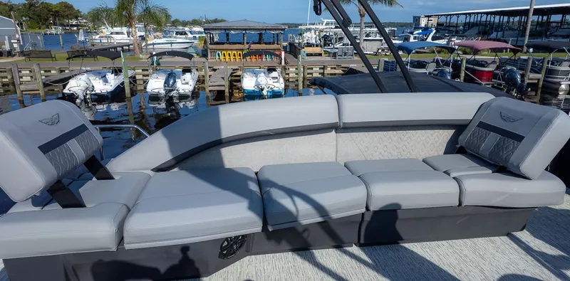 Slide: The Image of The image shows the lounge deck of a 2026 Bennington 24 M Stern Lounge boat. - 5