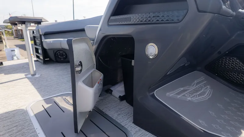 Slide: The Image of The image shows the interior of a 2026 Bennington 24 M Stern Lounge boat with modern seating and an open storage area. - 17