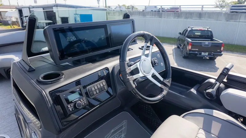 Slide: The Image of The cockpit of a modern boat with a steering wheel and electronic displays. - 19