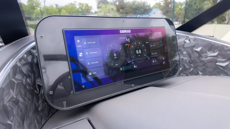 Slide: The Image of The image shows a modern Simrad display on a boat. - 29