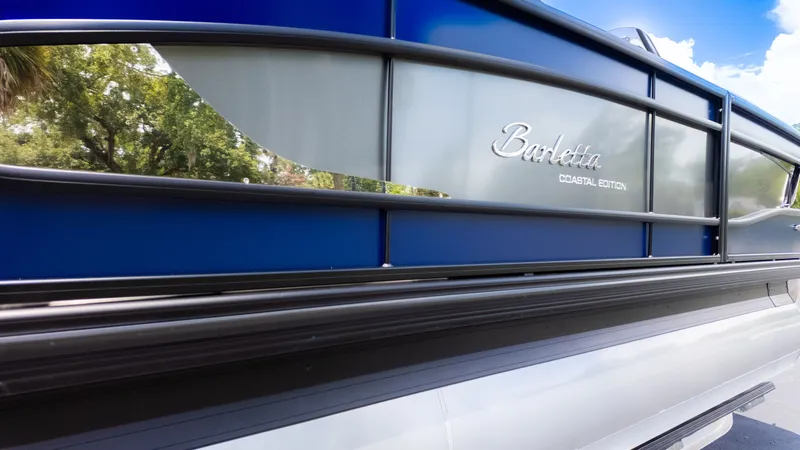 Slide: The Image of Close-up of the Barletta Lusso 23U with a sleek blue and silver design. - 3