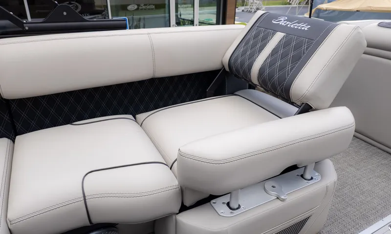 Slide: The Image of Luxurious seating area with cream upholstery and quilted backrest on a Barletta boat. - 18