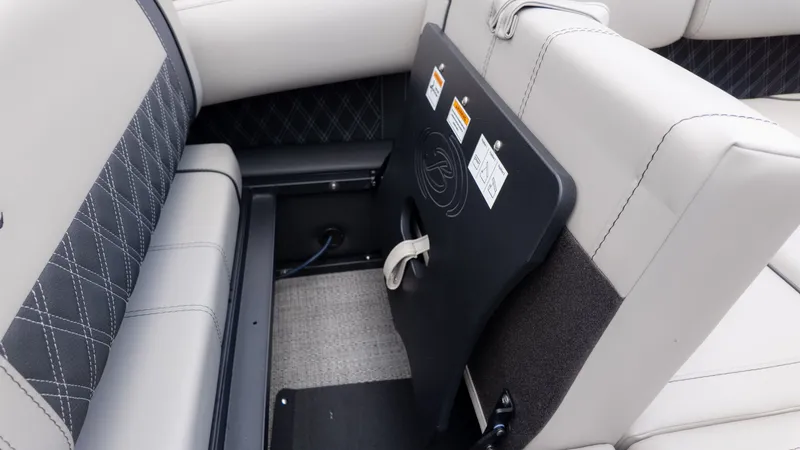 Slide: The Image of The image shows the interior of a Barletta Lusso 23U boat with gray upholstered seats. - 14
