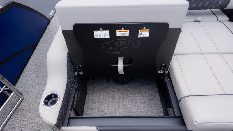 Slide: The Image of The image shows the seating area of a Barletta Lusso 23U boat with storage underneath. - 15