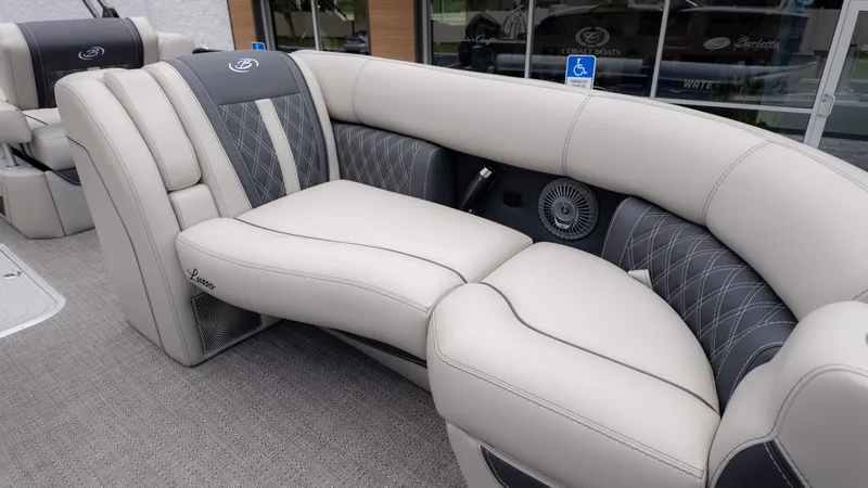 Slide: The Image of Luxurious seating area on a Barletta Lusso 23U boat, featuring gray and white upholstery. - 19