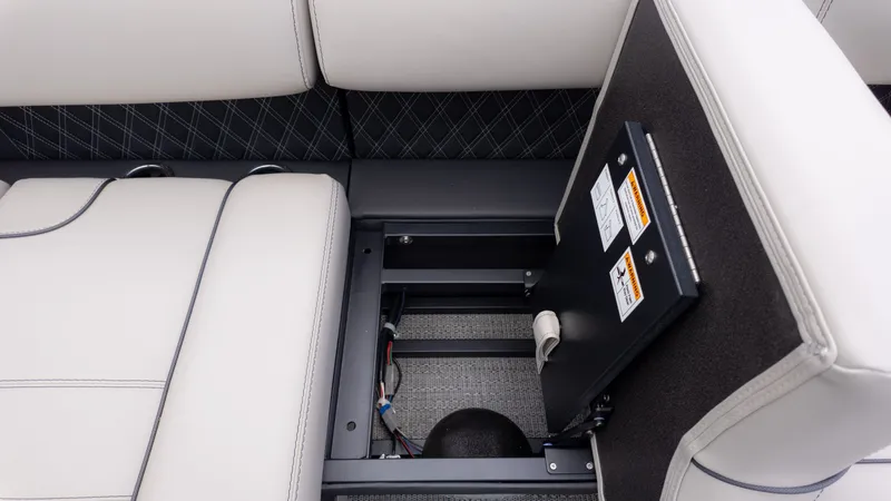 Slide: The Image of The image shows the seating area of a Barletta Lusso 23U boat with storage underneath. - 17