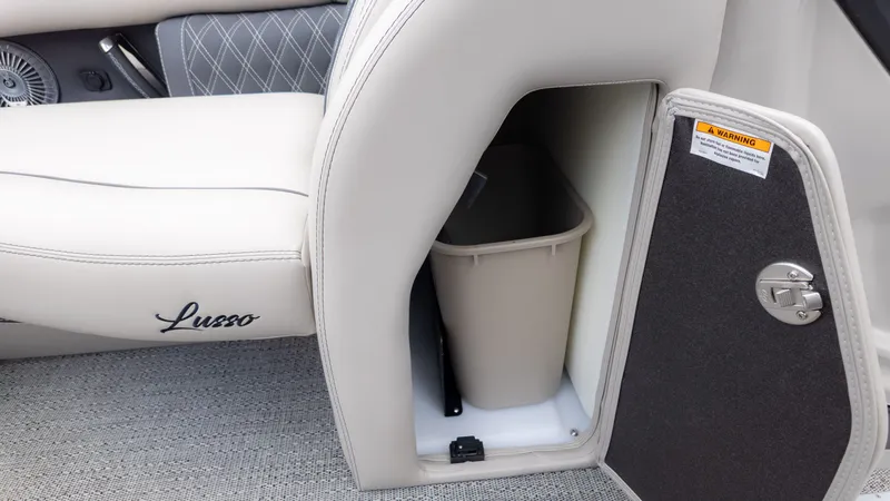 Slide: The Image of Interior of the Barletta Lusso 23U with a built-in trash bin behind a door. - 23